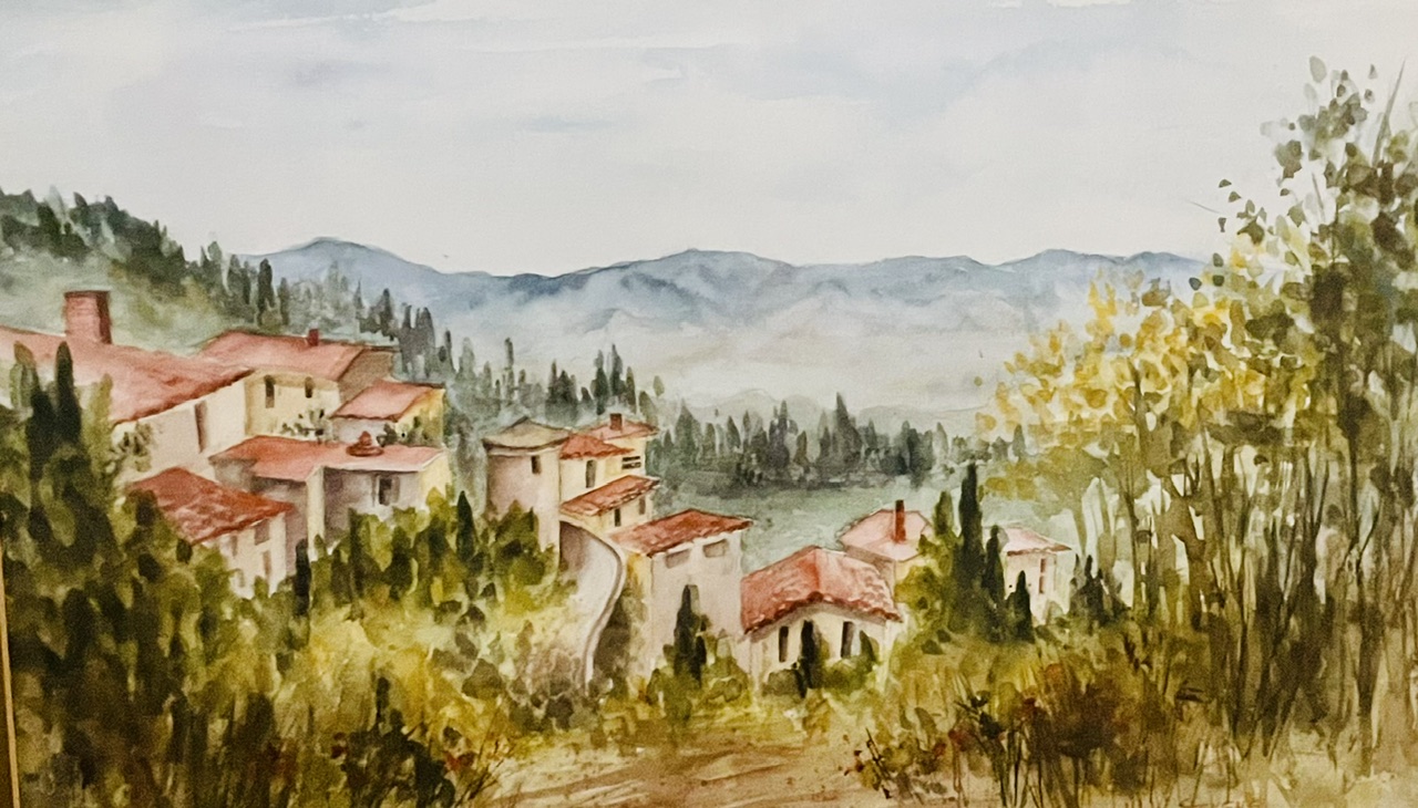 Watercolor landscape of a hillside Provençal village with red rooftops, by Vicki Stevens